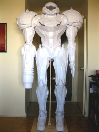 Illustration for article titled Stand in Awe of This Life-Sized Metroid Statue (Made of Paper!)